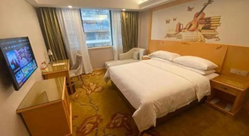 Bed in Vienna Hotel Guangdong Shaoguan Ruyuan Yao Cultural Square