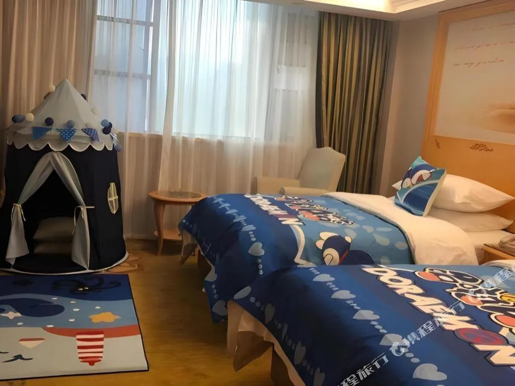 Bed in Vienna Hotel Guangdong Shaoguan Ruyuan Yao Cultural Square