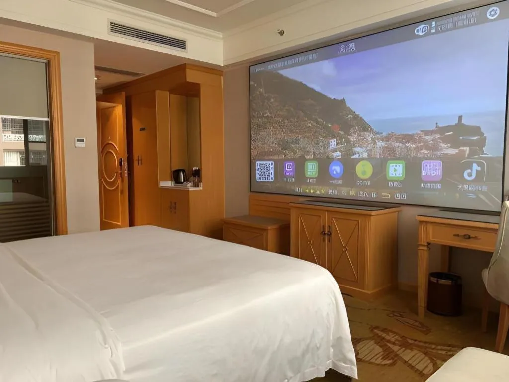 Bed in Vienna Hotel Guangdong Shaoguan Ruyuan Yao Cultural Square