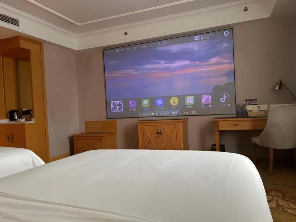 Bed in Vienna Hotel Guangdong Shaoguan Ruyuan Yao Cultural Square