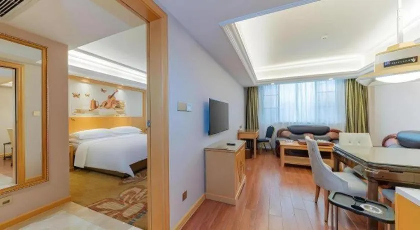 Bed in Vienna Hotel Guangdong Shaoguan Ruyuan Yao Cultural Square