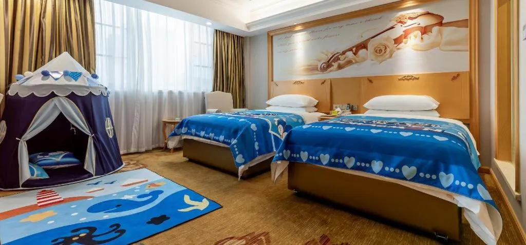 Bed in Vienna Hotel Guangdong Shaoguan Ruyuan Yao Cultural Square