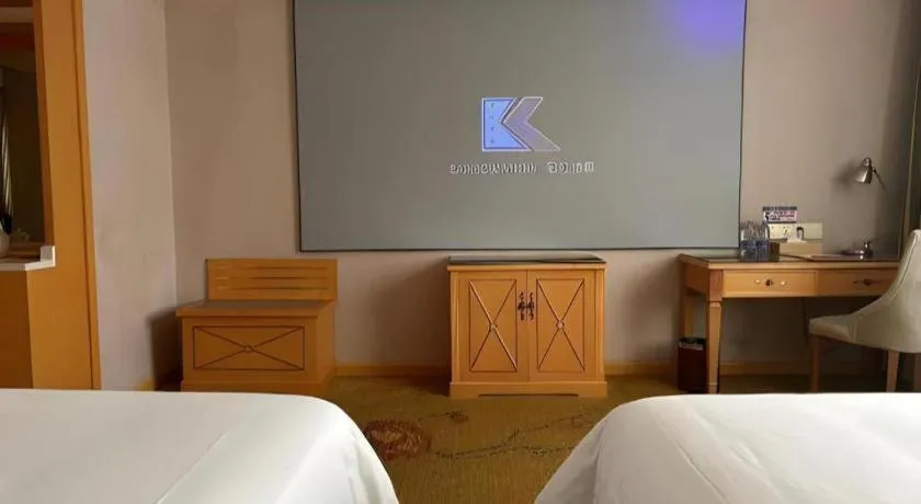 Bed in Vienna Hotel Guangdong Shaoguan Ruyuan Yao Cultural Square