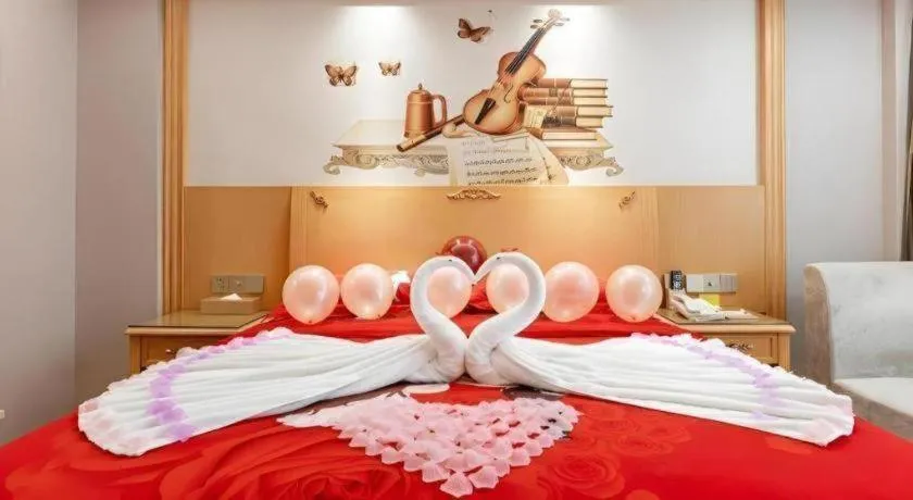 Bed in Vienna Hotel Guangdong Shaoguan Ruyuan Yao Cultural Square