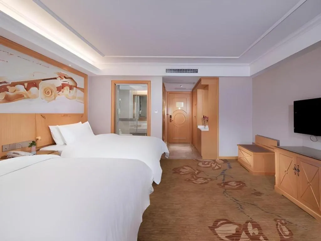 Bed in Vienna Hotel Guangdong Shaoguan Ruyuan Yao Cultural Square