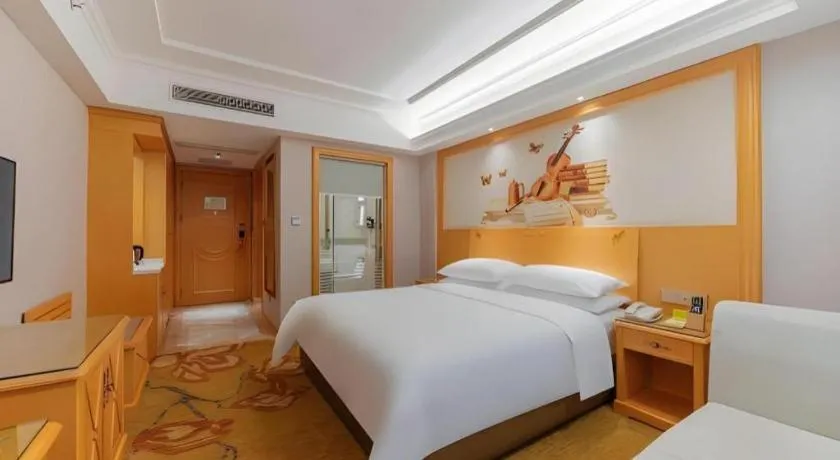 Bed in Vienna Hotel Guangdong Shaoguan Ruyuan Yao Cultural Square