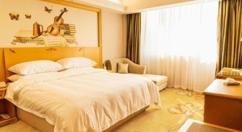 Bed in Vienna Hotel Guangdong Shaoguan Ruyuan Yao Cultural Square