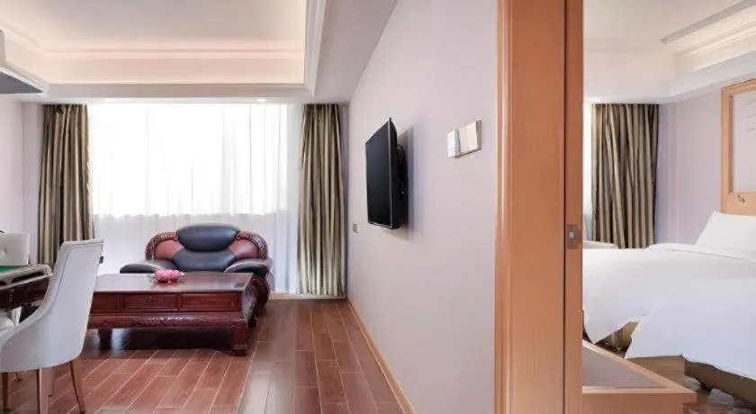 Bed in Vienna Hotel Guangdong Shaoguan Ruyuan Yao Cultural Square