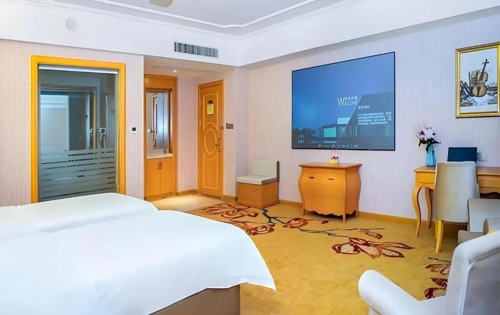 Bed in Vienna Hotel Guangdong Shaoguan Ruyuan Yao Cultural Square