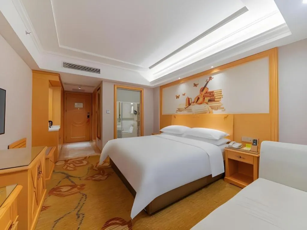 Bed in Vienna Hotel Guangdong Shaoguan Ruyuan Yao Cultural Square