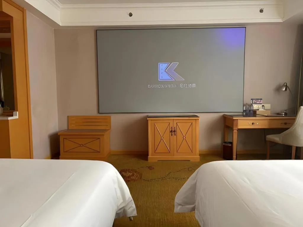 Bed in Vienna Hotel Guangdong Shaoguan Ruyuan Yao Cultural Square