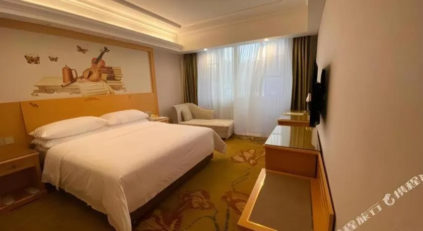 Bed in Vienna Hotel Guangdong Shaoguan Ruyuan Yao Cultural Square