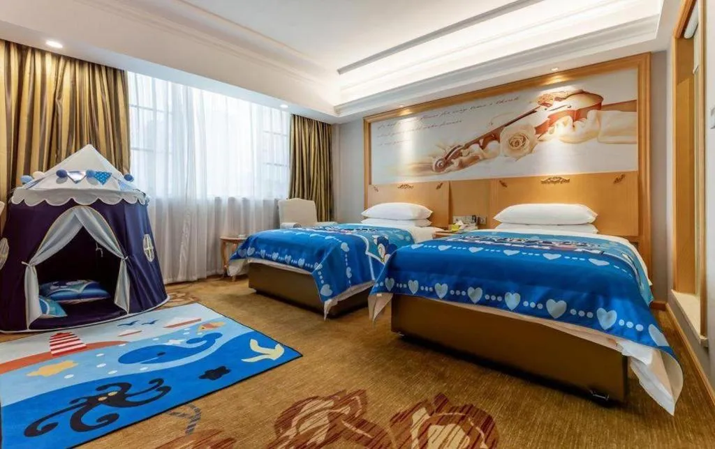 Bed in Vienna Hotel Guangdong Shaoguan Ruyuan Yao Cultural Square