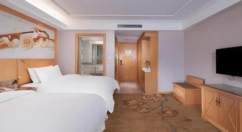 Bed in Vienna Hotel Guangdong Shaoguan Ruyuan Yao Cultural Square