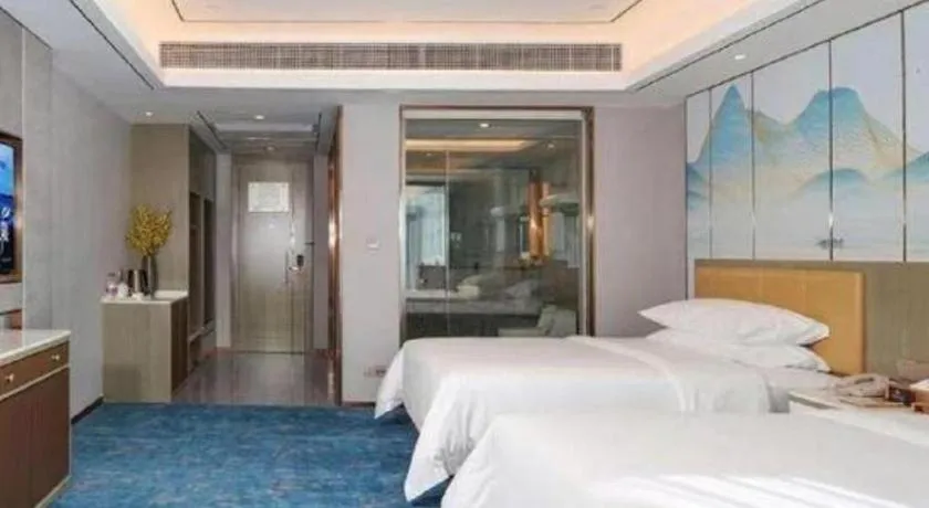 Bed in Venus Royal Hotel Guangxi Wuzhou Sanqicheng Meiguihu Park