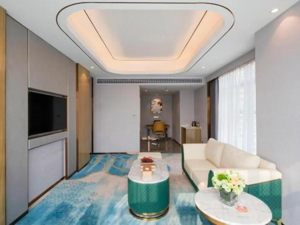 Bed in Venus Royal Hotel Guangxi Wuzhou Sanqicheng Meiguihu Park