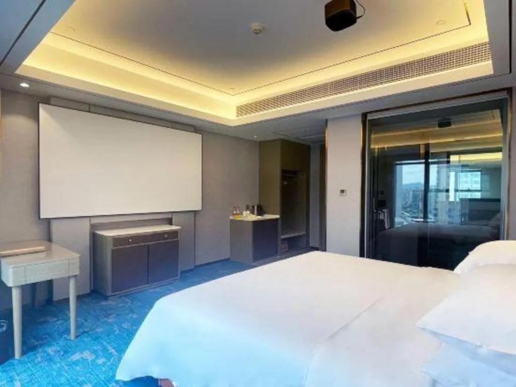 Bed in Venus Royal Hotel Guangxi Wuzhou Sanqicheng Meiguihu Park