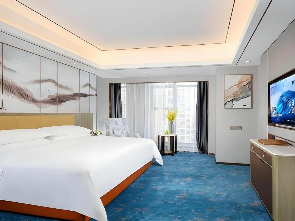 Bed in Venus Royal Hotel Guangxi Wuzhou Sanqicheng Meiguihu Park