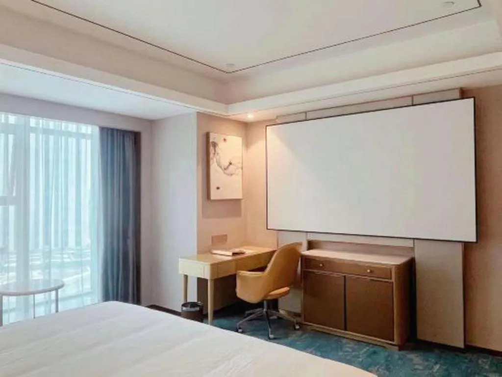 Bed in Venus Royal Hotel Guangxi Wuzhou Sanqicheng Meiguihu Park