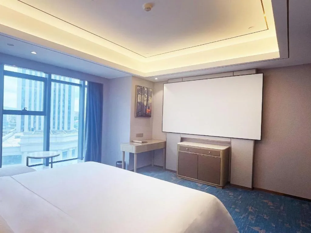 Bed in Venus Royal Hotel Guangxi Wuzhou Sanqicheng Meiguihu Park