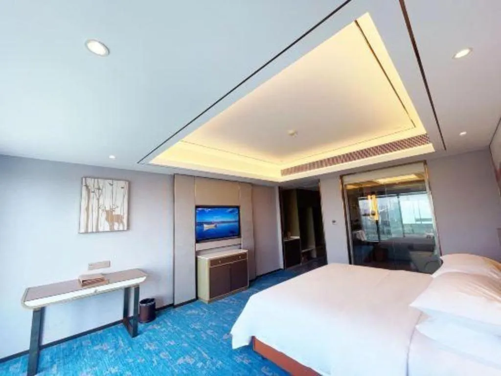 Bed in Venus Royal Hotel Guangxi Wuzhou Sanqicheng Meiguihu Park