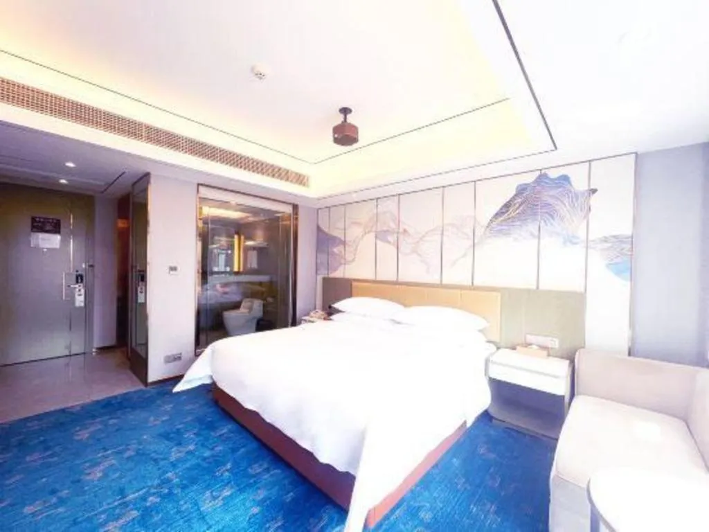 Bed in Venus Royal Hotel Guangxi Wuzhou Sanqicheng Meiguihu Park