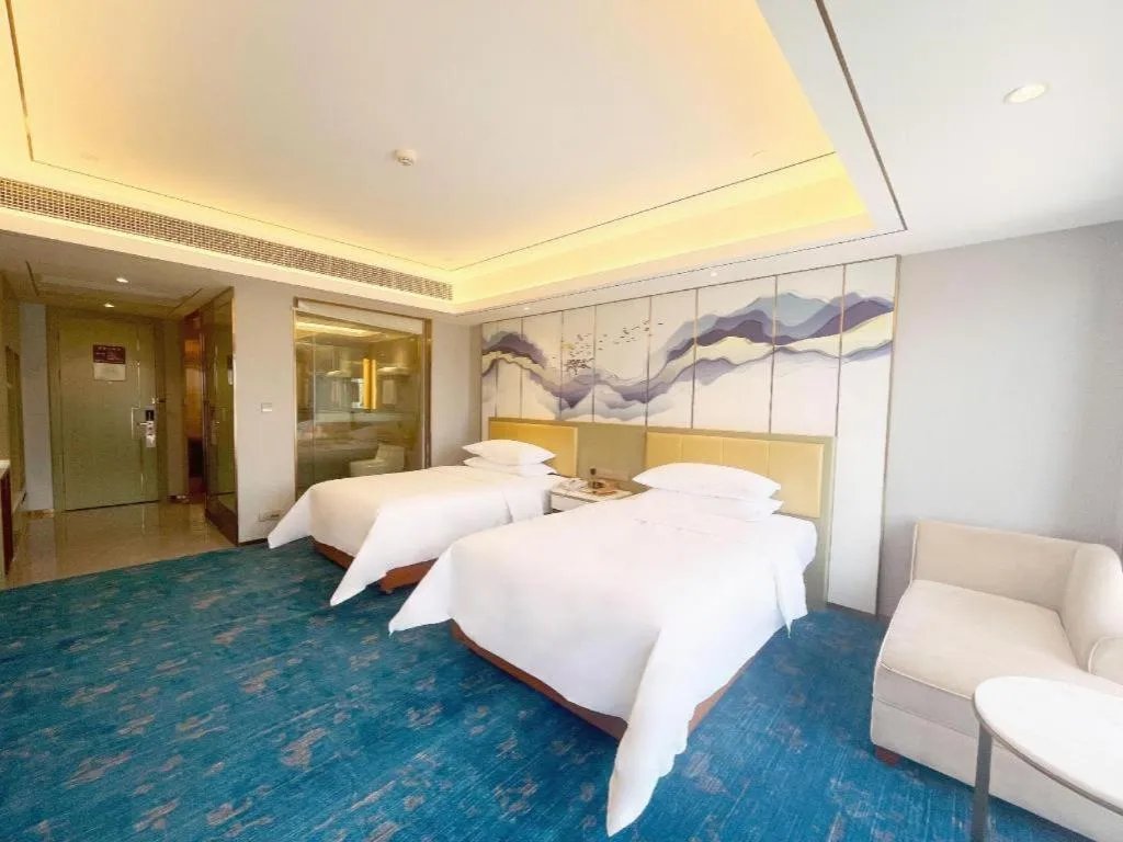 Bed in Venus Royal Hotel Guangxi Wuzhou Sanqicheng Meiguihu Park