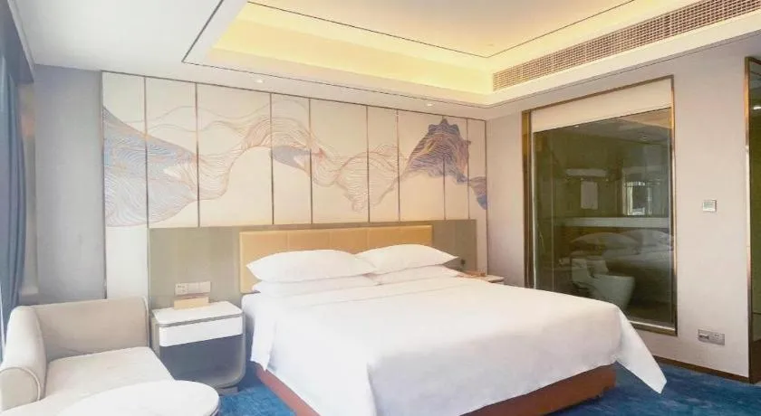 Bed in Venus Royal Hotel Guangxi Wuzhou Sanqicheng Meiguihu Park