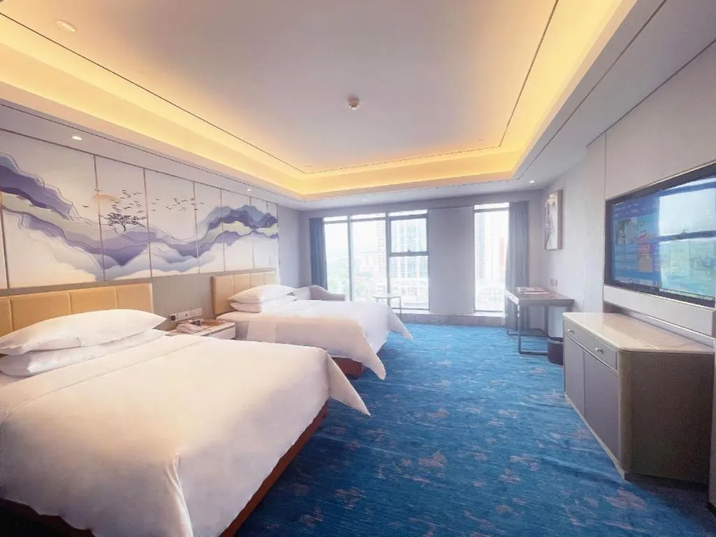 Bed in Venus Royal Hotel Guangxi Wuzhou Sanqicheng Meiguihu Park