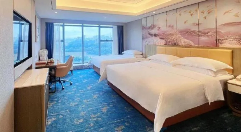 Bed in Venus Royal Hotel Guangxi Wuzhou Sanqicheng Meiguihu Park