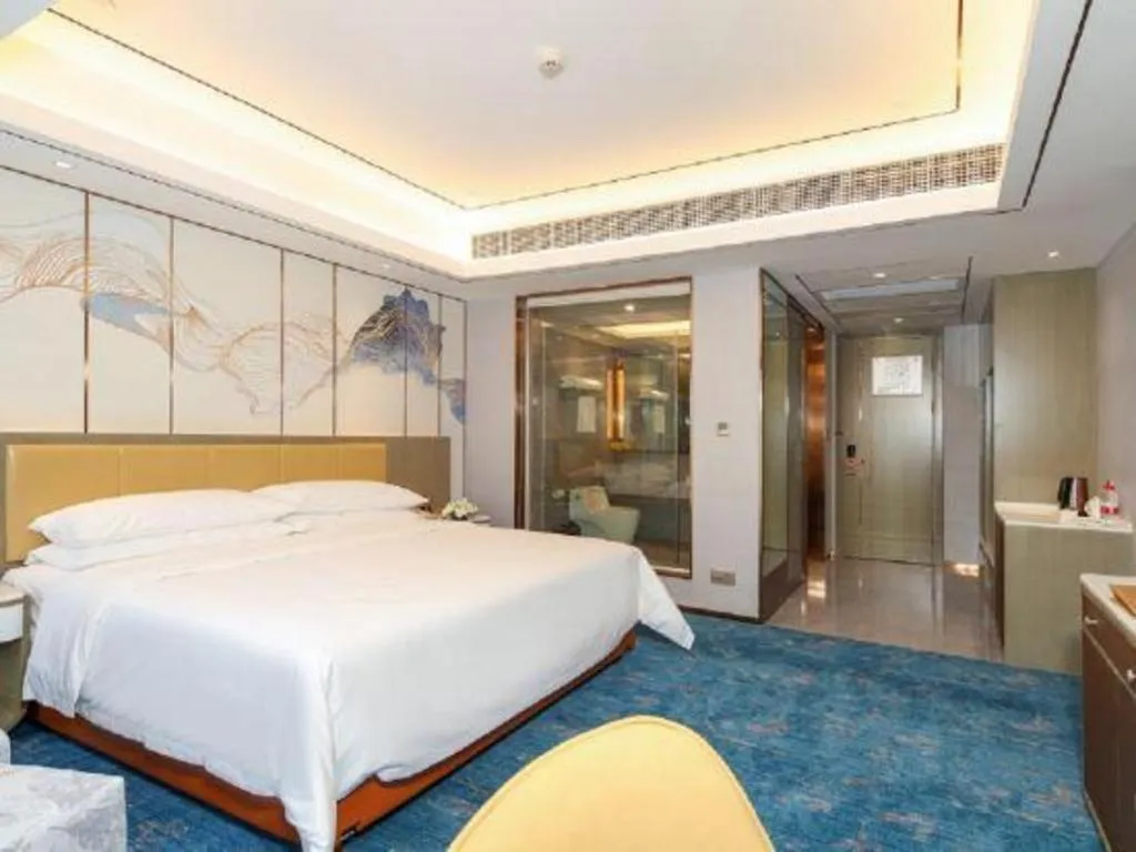 Bed in Venus Royal Hotel Guangxi Wuzhou Sanqicheng Meiguihu Park