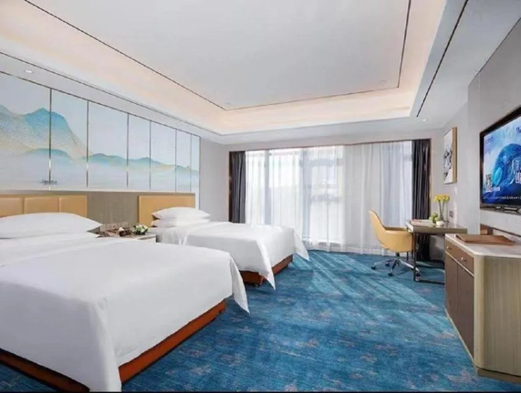 Bed in Venus Royal Hotel Guangxi Wuzhou Sanqicheng Meiguihu Park