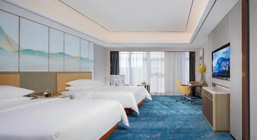 Bed in Venus Royal Hotel Guangxi Wuzhou Sanqicheng Meiguihu Park