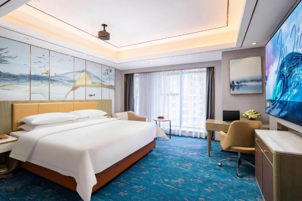 Bed in Venus Royal Hotel Guangxi Wuzhou Sanqicheng Meiguihu Park