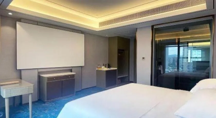 Bed in Venus Royal Hotel Guangxi Wuzhou Sanqicheng Meiguihu Park