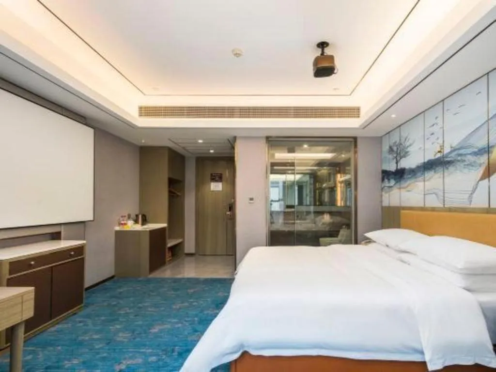 Bed in Venus Royal Hotel Guangxi Wuzhou Sanqicheng Meiguihu Park