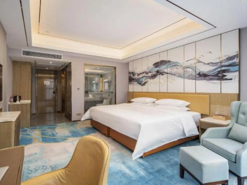 Bed in Venus Royal Hotel Guangxi Wuzhou Sanqicheng Meiguihu Park