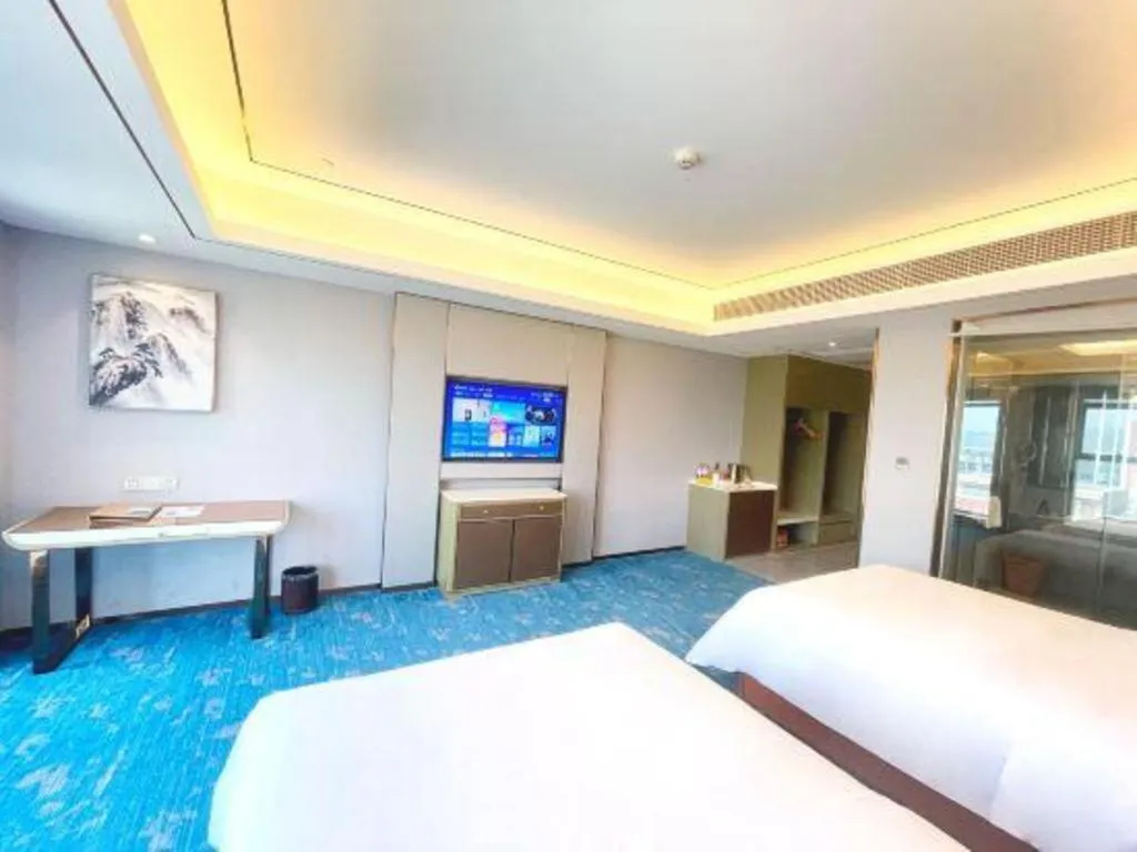 Bed in Venus Royal Hotel Guangxi Wuzhou Sanqicheng Meiguihu Park