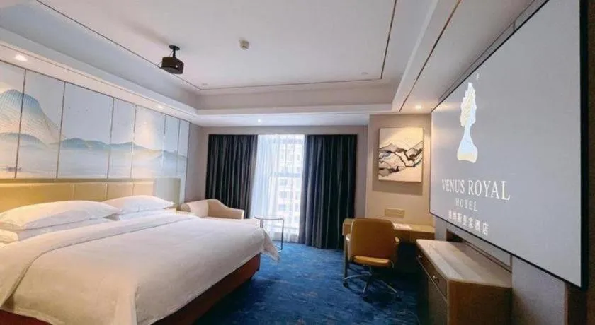 Bed in Venus Royal Hotel Guangxi Wuzhou Sanqicheng Meiguihu Park