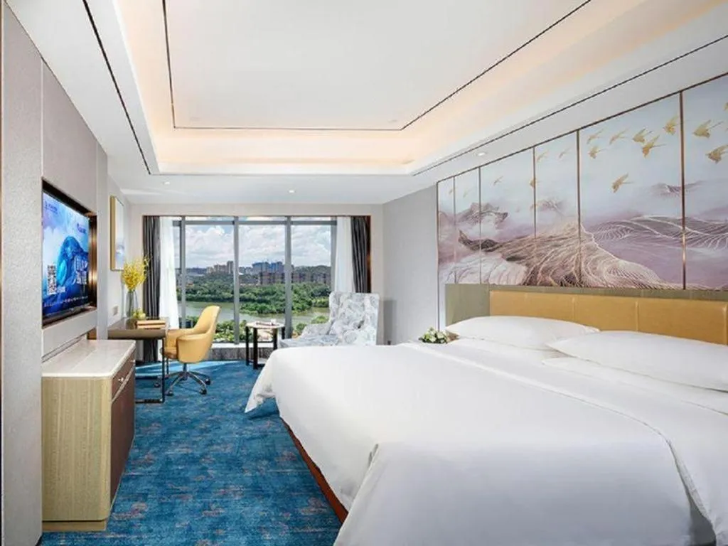 Bed in Venus Royal Hotel Guangxi Wuzhou Sanqicheng Meiguihu Park