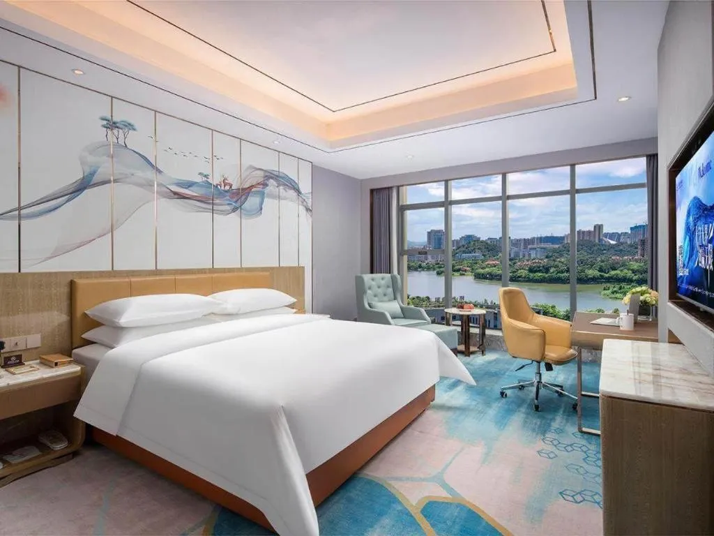 Bed in Venus Royal Hotel Guangxi Wuzhou Sanqicheng Meiguihu Park