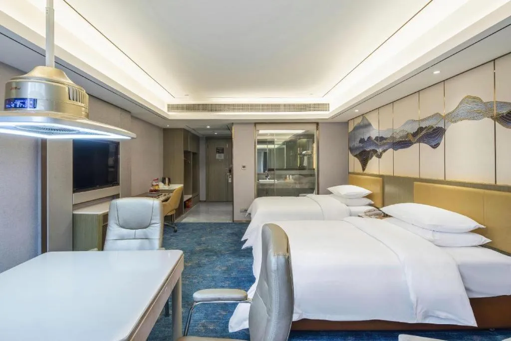 Bed in Venus Royal Hotel Guangxi Wuzhou Sanqicheng Meiguihu Park