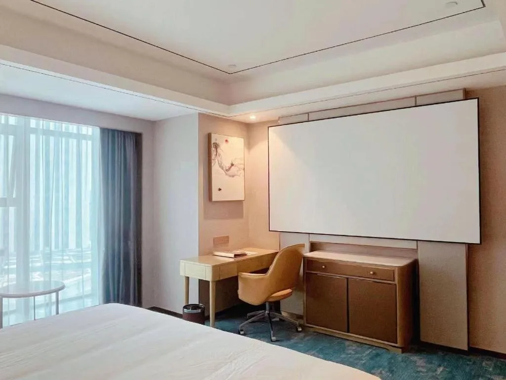 Bed in Venus Royal Hotel Guangxi Wuzhou Sanqicheng Meiguihu Park