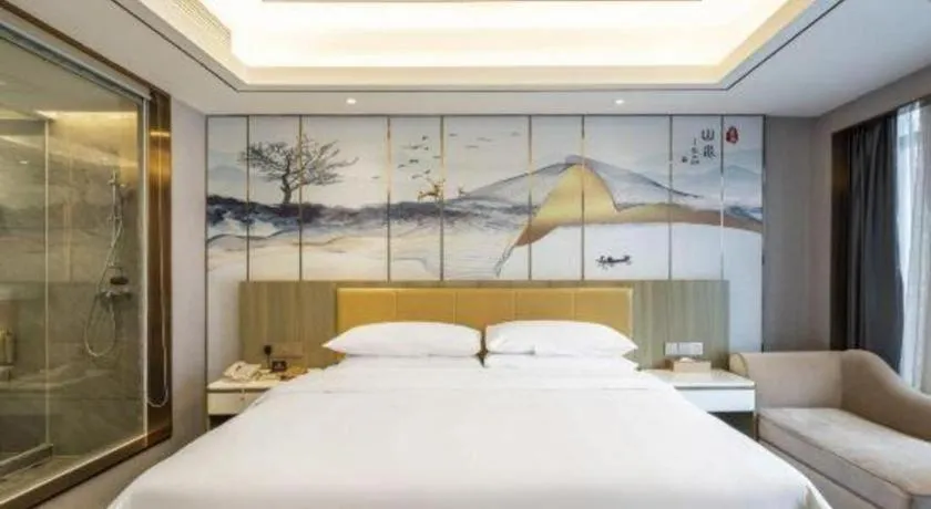 Bed in Venus Royal Hotel Guangxi Wuzhou Sanqicheng Meiguihu Park