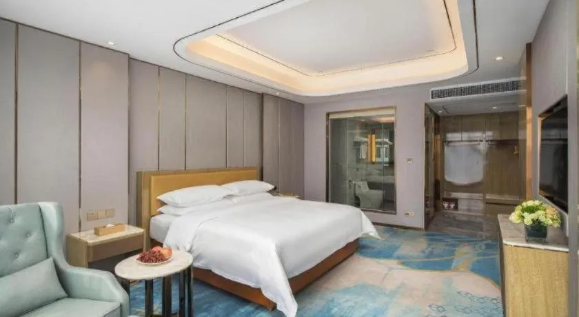 Bed in Venus Royal Hotel Guangxi Wuzhou Sanqicheng Meiguihu Park