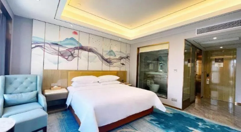 Bed in Venus Royal Hotel Guangxi Wuzhou Sanqicheng Meiguihu Park