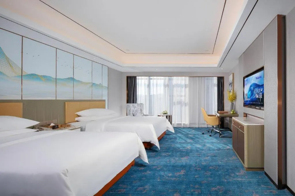 Bed in Venus Royal Hotel Guangxi Wuzhou Sanqicheng Meiguihu Park