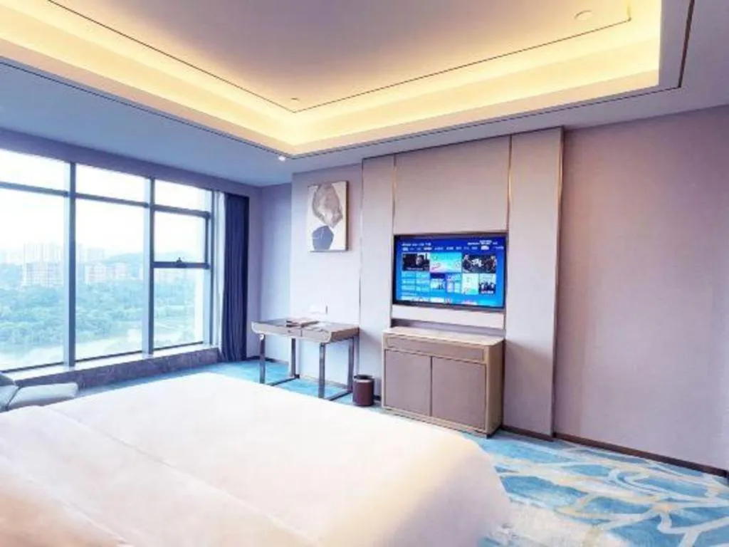 Bed in Venus Royal Hotel Guangxi Wuzhou Sanqicheng Meiguihu Park