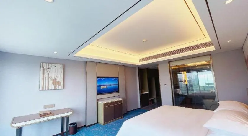 Bed in Venus Royal Hotel Guangxi Wuzhou Sanqicheng Meiguihu Park