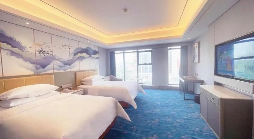 Bed in Venus Royal Hotel Guangxi Wuzhou Sanqicheng Meiguihu Park